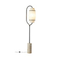 **Technische titel in het Nederlands:** Modern vloerlampontwerp met cilindrische voet en opaal glazen lamp.